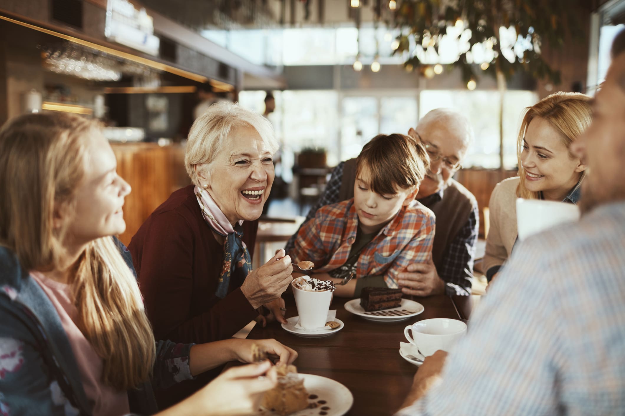 Multi Generational Family in a Cafe Close up of a happy family enjoying time together at Quartet.