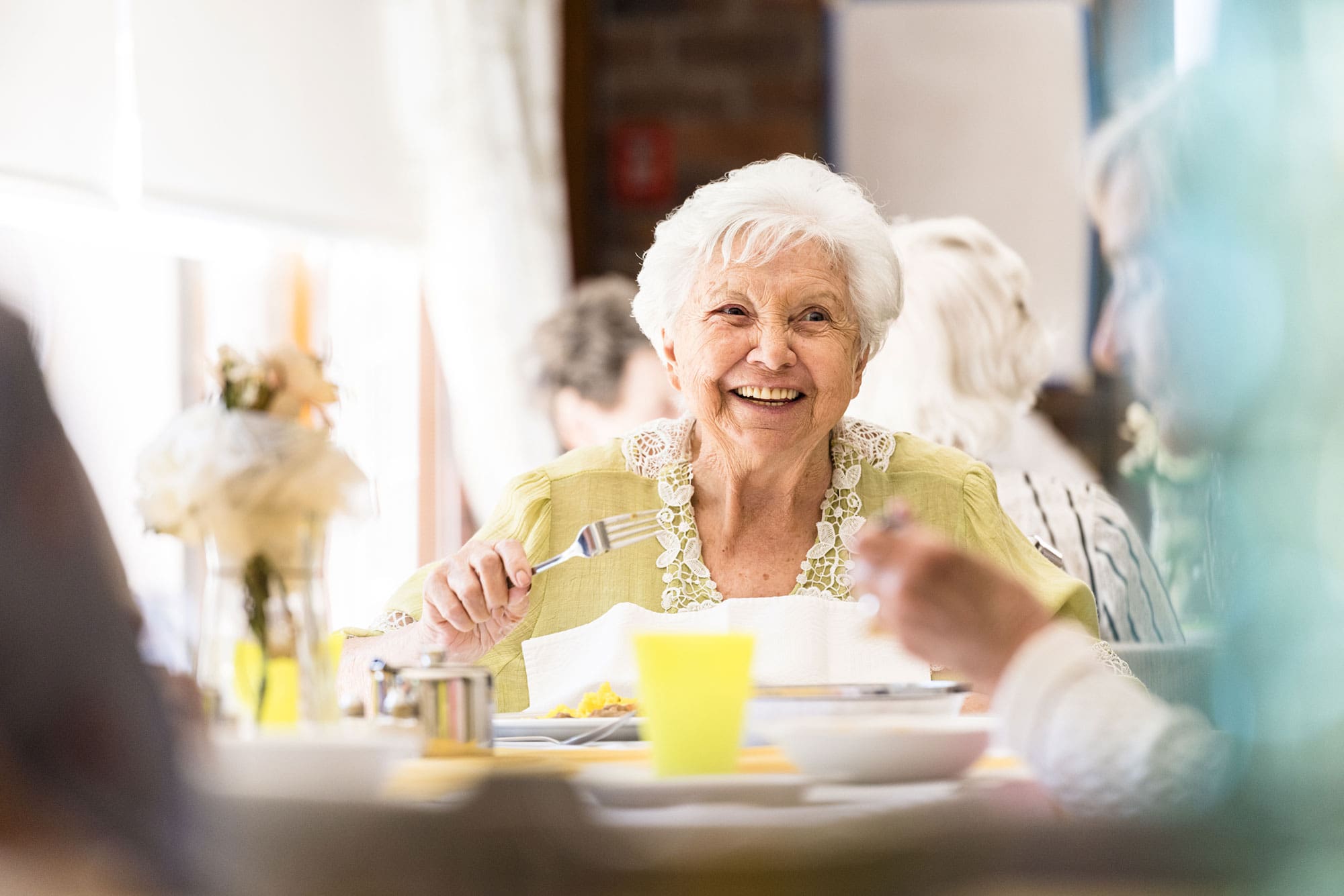 AL-Lower-Image senior woman enjoying lunch with friends