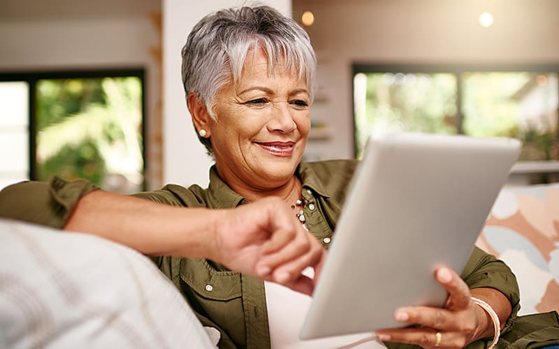 Senior woman using an adaptive tablet