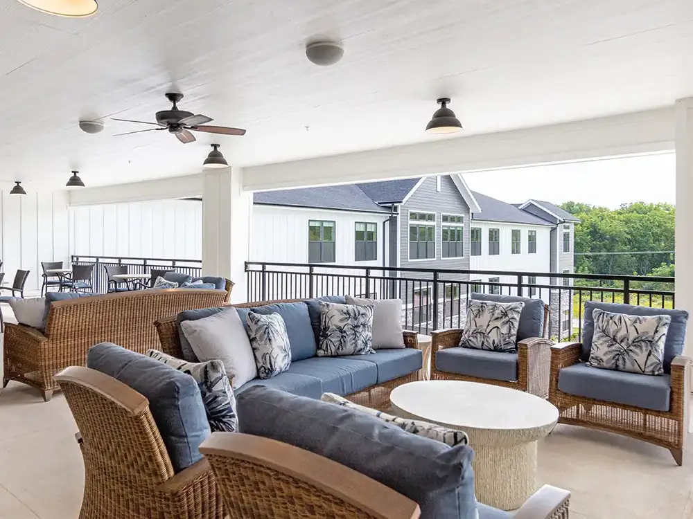 Spacious Assisted Living apartment with modern kitchen and cozy seating at Quartet Senior Living in Bettendorf.