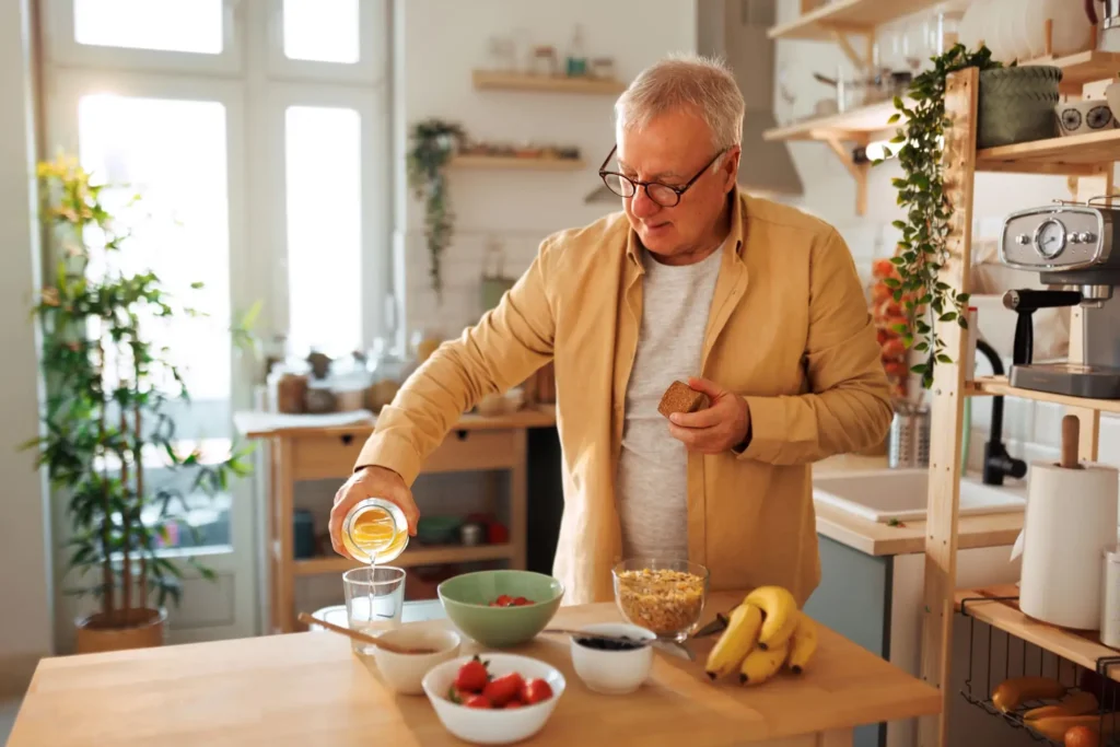 older man making low cholesterol meal